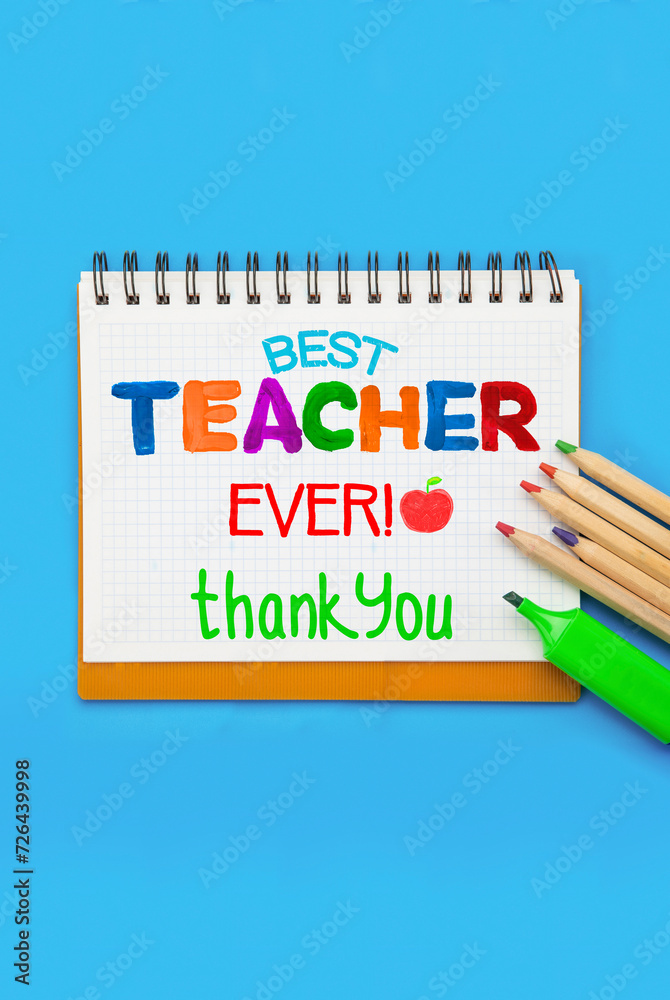 Childish lettering for Teachers' Day on notebook or scrapbook. Appreciation of teachers top view flat lay concept. Colored paper, multi-coloured letters, supplies Childish lettering for Teachers' Day on notebook or scrapbook. Appreciation of teachers top view flat lay concept. Colored paper, multi-coloured letters, supplies