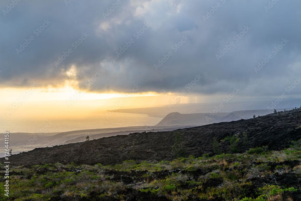 sunset over the volcanos with green plants on big island in hawaii sunset over the volcanos with green plants on big island in hawaii