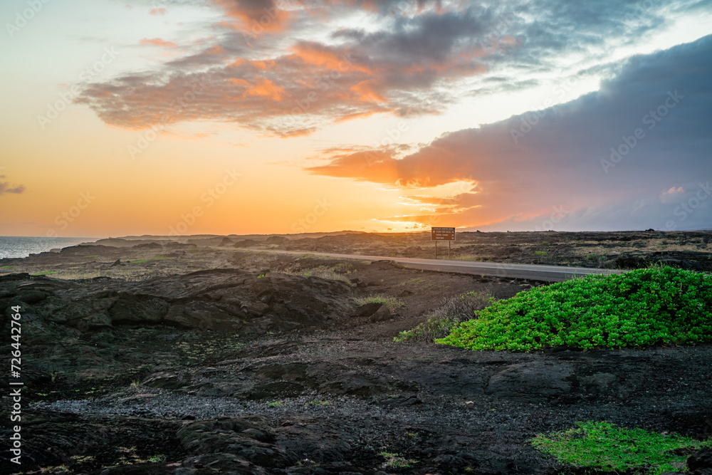 sunset over the volcanos with green plants on big island in hawaii sunset over the volcanos with green plants on big island in hawaii
