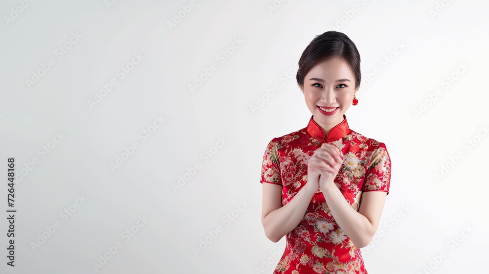 Beautiful young asian woman wearing cheongsam posing in smile for chinese new year concept isolated on white background. Asian woman with clean fresh skin posing for celebration of Chinesse New Year. Beautiful young asian woman wearing cheongsam posing in smile for chinese new year concept isolated on white background. Asian woman with clean fresh skin posing for celebration of Chinesse New Year.