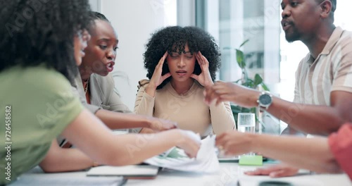 Business people, meeting and conflict with documents, headache or stress in mental health at office. Frustrated woman employee or team fighting in argument or disagreement with paperwork at workplace photo