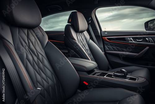 Modern Luxury Car Interior. black leather seats. Car detailing. © Creative