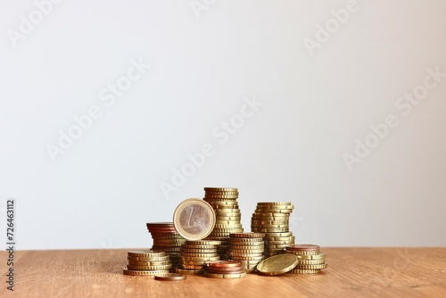 pile of money, stack of money, stacked euro coins on white background, concept of money income, household budget, finances, tax return, invoice, pay salary, shares, profit