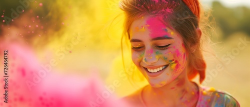 Portrait happy smiling young girl celebrating holi festival, colorful face, vibrant powder paint explosion © Tymofii