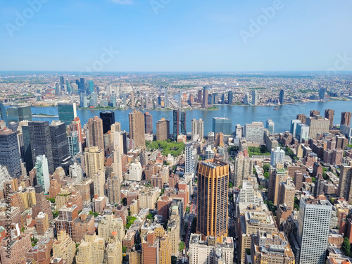 Photography Aerial view of New York City's dense skyline captured from the Empire State