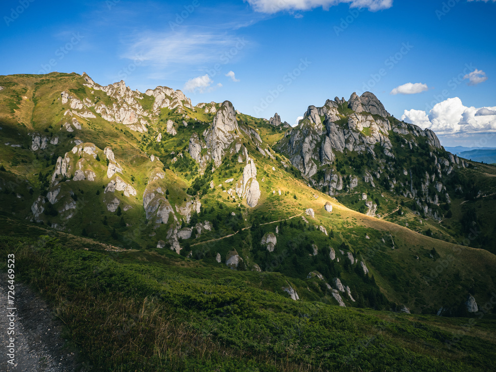 Obraz premium Sun shining on beautiful limestone formations in Carpathian mountains