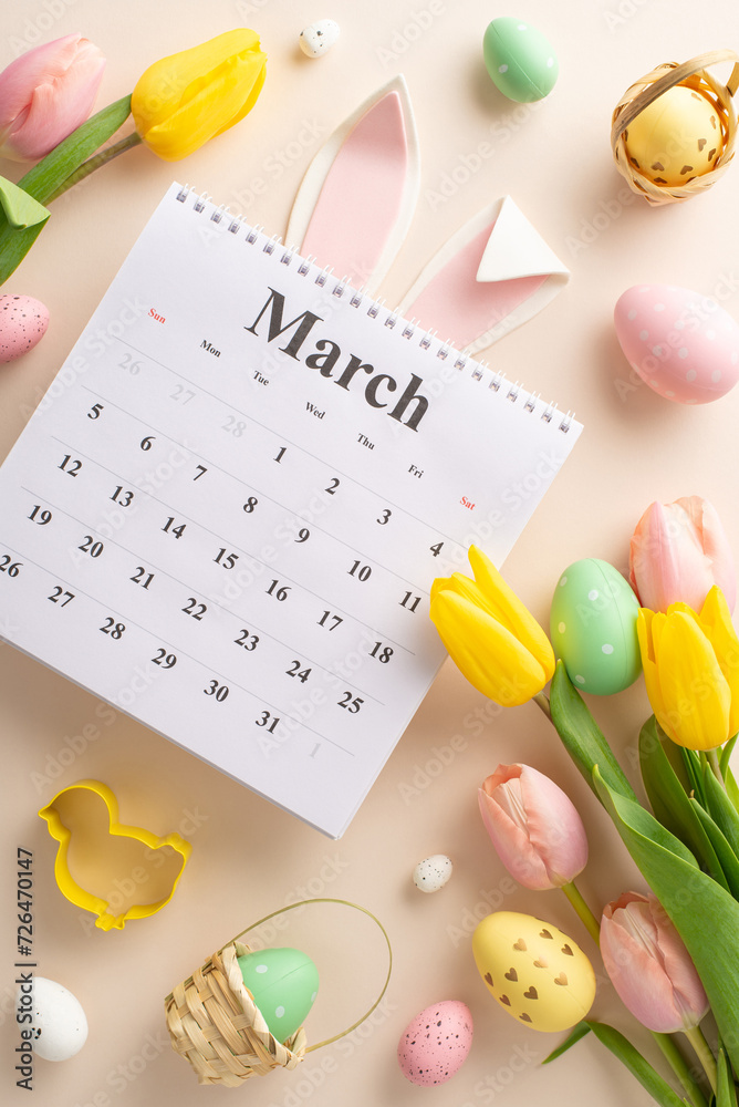 Springtime Revelry Admirer: Top-view vertical image of March calendar, colorful eggs, whimsical bunny ears, baking molds, tulips on gentle pastel surface. Customizable space for your message or advert