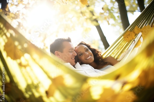 couple relaxing in hammock, sun shining through leaves