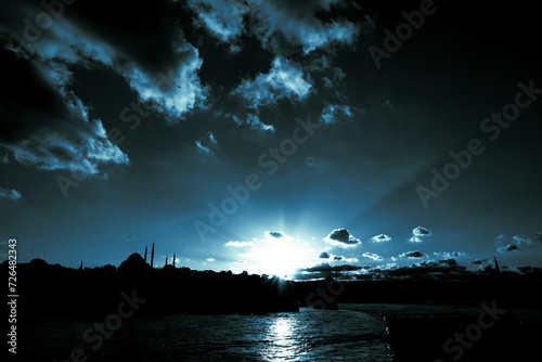 Silhouette of Istanbul at sunset. Blue tonned monochrome photo of Istanbul.