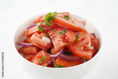 Salad with fresh tomatoes, olive oil, onions, parsley and fennel.