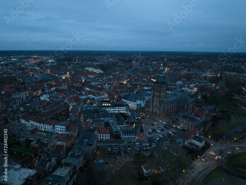 Aerial overview at dusk of the city of Zutphen, along the river Ijssel in Gelderland, The Netherlands. Birds eye aerial drone view in the Dutch province of Gelderland.