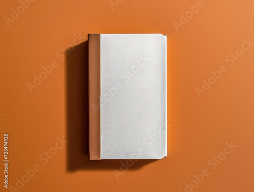 Blank White and Brown Book on Orange Background - Generative AI