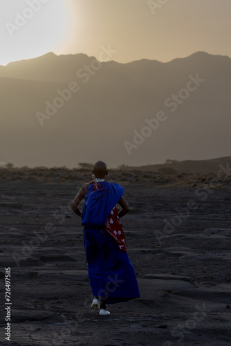 
Masai woman walkinginto the sunset at Lake Natron, Tanzania, Africa photo