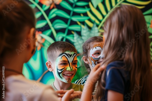 group of kids with face paint at a junglethemed backdrop photo
