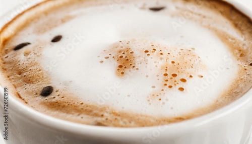 Close up of cappuccino foam or coffee with milk. Tasty hot drink.