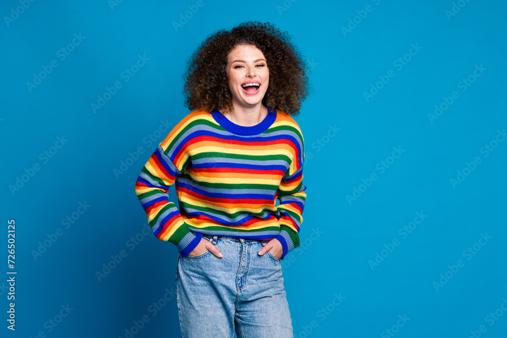 Photo portrait of pretty young girl laugh posing new trousers dressed stylish rainbow print outfit isolated on blue color background Photo portrait of pretty young girl laugh posing new trousers dressed stylish rainbow print outfit isolated on blue color background