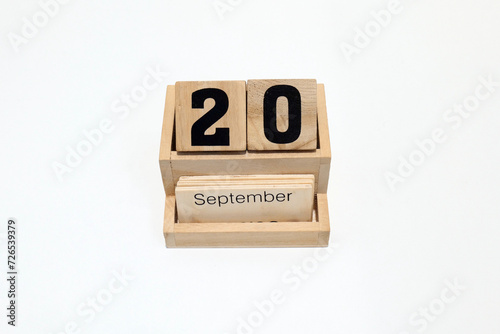 20th of September wooden perpetual calendar. Shot close up isolated on a white background