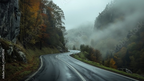 Dark misty day with empty Winding mountain road