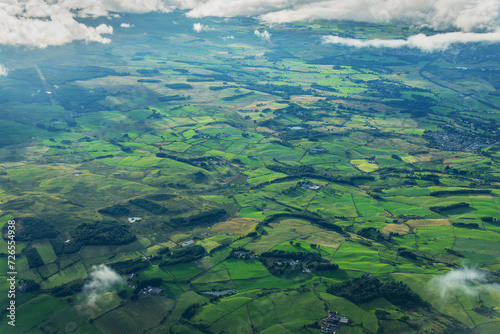 Aerial view of green fields in the scottish countryside near Glasgow, Central Lowlands of Scotland, UK