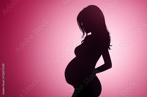 pregnant woman shadow illustration with pink background and copy space for international women's day celebrations 