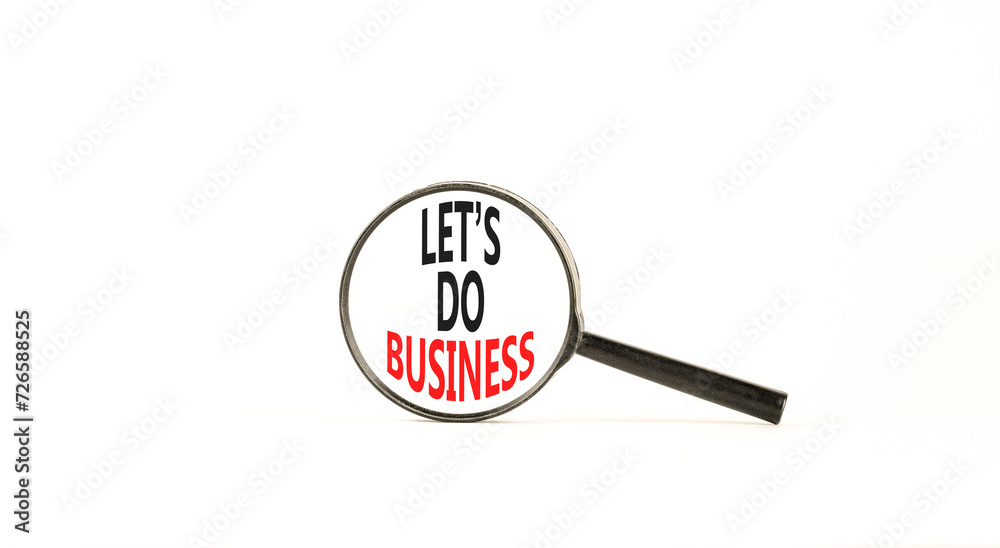 let is do business symbol. Concept words let is do business in beautiful magnifying glass. Beautiful white table white background. let is do business concept. Copy space. let is do business symbol. Concept words let is do business in beautiful magnifying glass. Beautiful white table white background. let is do business concept. Copy space.