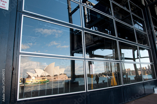 Reflection of Sydney Opera House in windows of a building photo