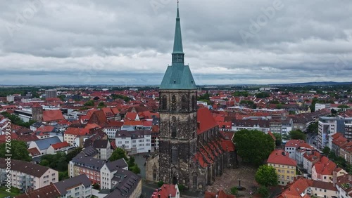 Aerial Drone view of The church of St. Andreas or Andreaskirche , it is the principal Lutheran church of Hildesheim, Germany. Its is the tallest church tower in Lower Saxony