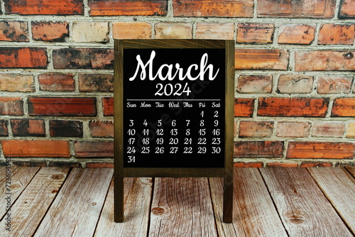 March 2024 monthly calendar on chalkboard for planning and management