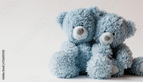 A pair of blue teddy bears embracing, their adorable presence against a spotless white background symbolizing love and companionship