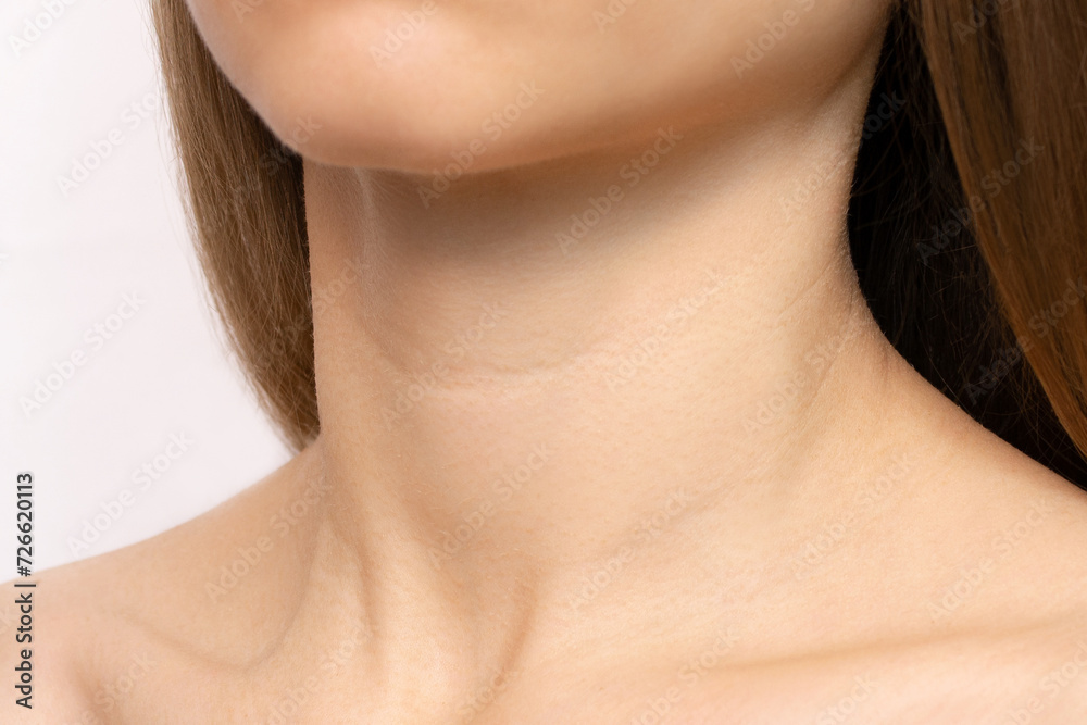 Close-up of creases and wrinkles on the neck of a young woman. Age-related skin changes, lines or rings of Venus, goosebump skin. Beauty and women's health care concept Close-up of creases and wrinkles on the neck of a young woman. Age-related skin changes, lines or rings of Venus, goosebump skin. Beauty and women's health care concept