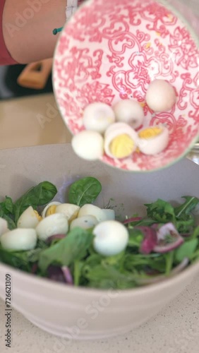 Preparing salad with boiled eggs. Vertical video