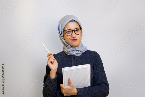 Muslim woman on college student outfit concept.
 photo