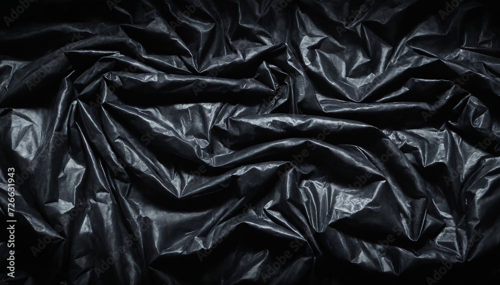 Black plastic bag texture. Dark material background