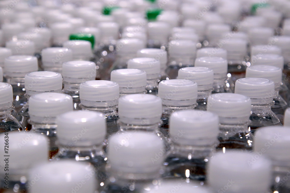 Drinking water bottle on a factory production conveyor belt line Drinking water bottle on a factory production conveyor belt line