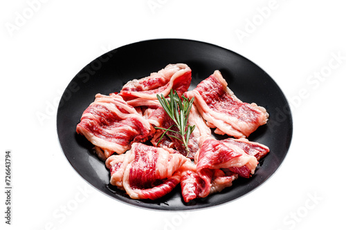 Raw beef bacon, marbled meat in a plate. Isolated, Transparent background.