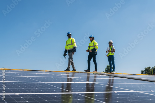 Wallpaper Mural Service engineer checking solar cell on the roof for maintenance if there is a damaged part. Engineer worker install solar panel. Clean energy concept. Torontodigital.ca