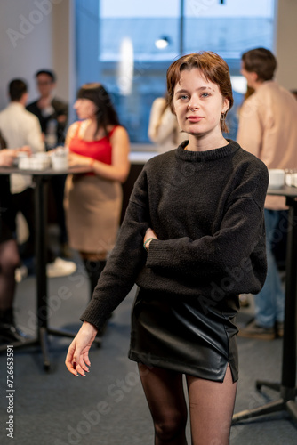 Fototapeta Naklejka Na Ścianę i Meble -  portrait of a young girl at a business conference during a coffee break working networking