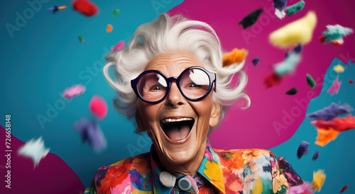 Happy grandmother posing on colored backgrounds