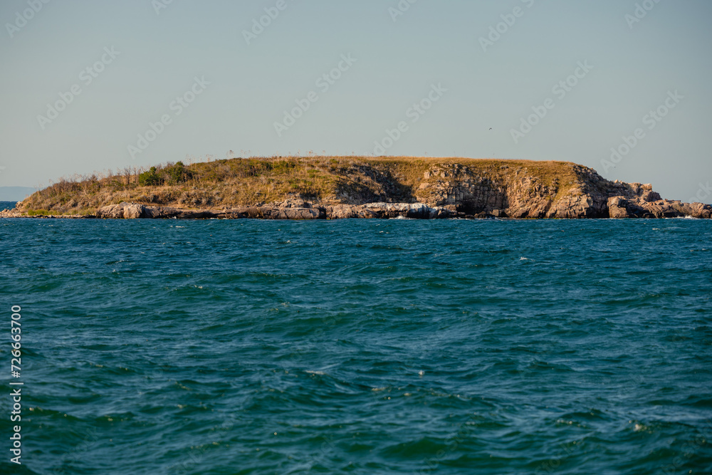 Snake island. An island in Bulgaria that is said to have many different species of snakes. The Black Sea around the island. Beautiful summer landscape Snake island. An island in Bulgaria that is said to have many different species of snakes. The Black Sea around the island. Beautiful summer landscape