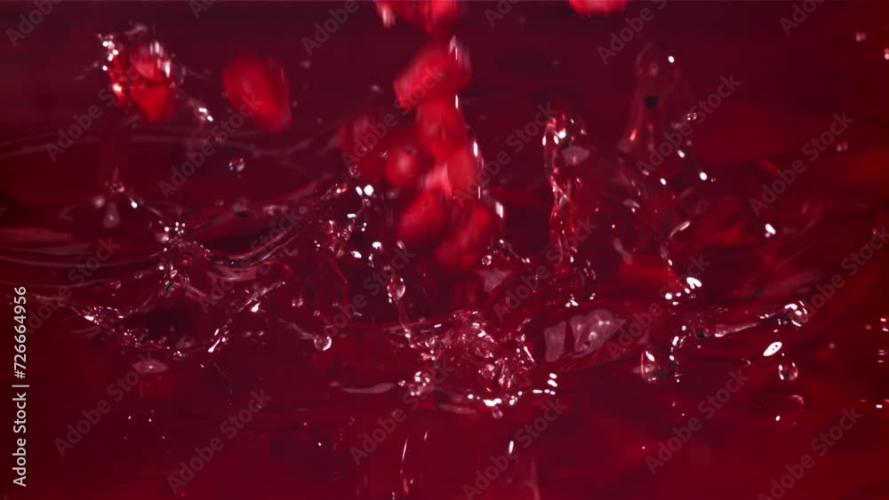 Pomegranate seeds fall into the juice. Filmed on a high-speed camera at 1000 fps. High quality FullHD footage Pomegranate seeds fall into the juice. Filmed on a high-speed camera at 1000 fps. High quality FullHD footage