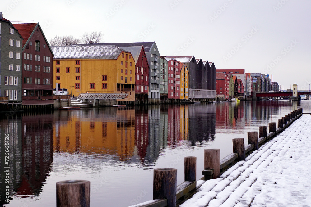 Colorful old houses on the water in Trondheim Norway in winter