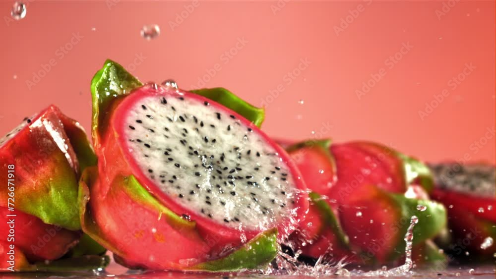Drops of water fall on a tropical dragon fruit. Filmed on a high-speed camera at 1000 fps. High quality FullHD footage Drops of water fall on a tropical dragon fruit. Filmed on a high-speed camera at 1000 fps. High quality FullHD footage