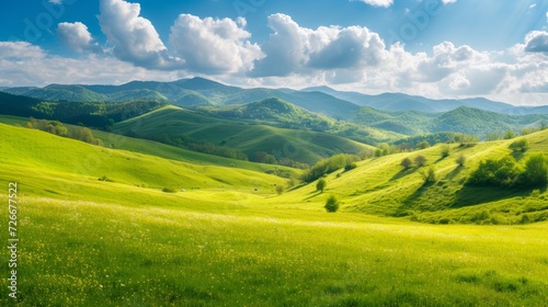 panorama of beautiful countryside of romania. sunny afternoon. wonderful springtime landscape in mountains. grassy field and rolling hills. rural scenery