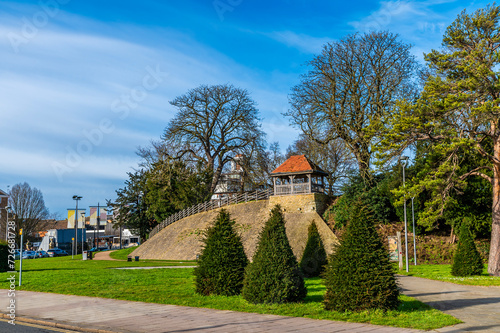 A view towards the castle hill beside the River Great Ouse in Bedford, UK on a bright sunny day photo