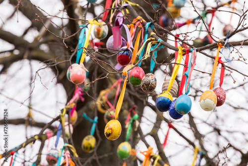 Easter tree with eggs. Many colorful multicolored painted easter egg on branch close up, abstract background