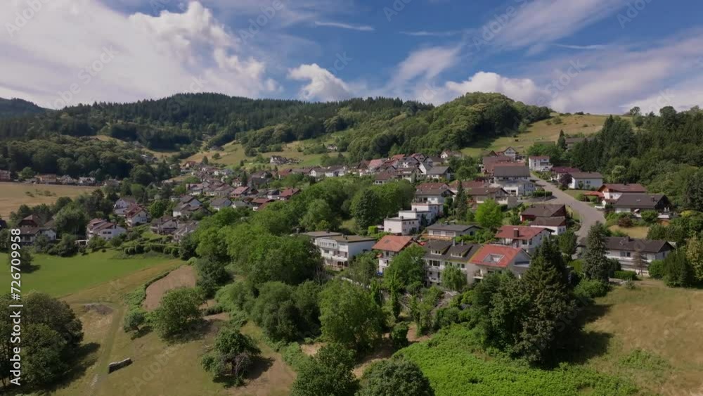 Aerial view of a quaint village nestled in the lush German countryside Aerial view of a quaint village nestled in the lush German countryside