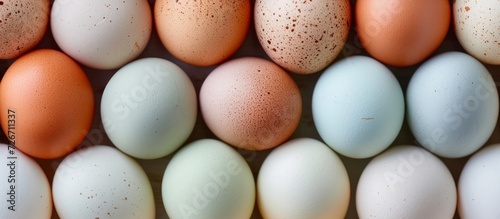 Various hues of free range chicken eggs, including brown, white, and pastel shades.