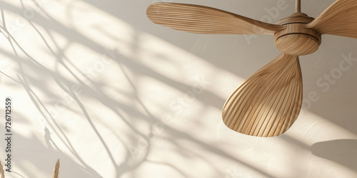 Modern wooden Ceiling Fan in a Cozy Living Room, copy space. Contemporary ceiling fan with light, blending seamlessly into a bright, stylish home interior.