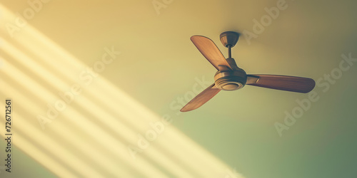 Modern Ceiling Fan in a Cozy Living Room, copy space. Contemporary ceiling fan with light, blending seamlessly into a bright, stylish home interior.