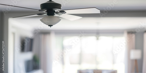 Modern Ceiling Fan in a Cozy Living Room, copy space. Contemporary ceiling fan with light, blending seamlessly into a bright, stylish home interior.